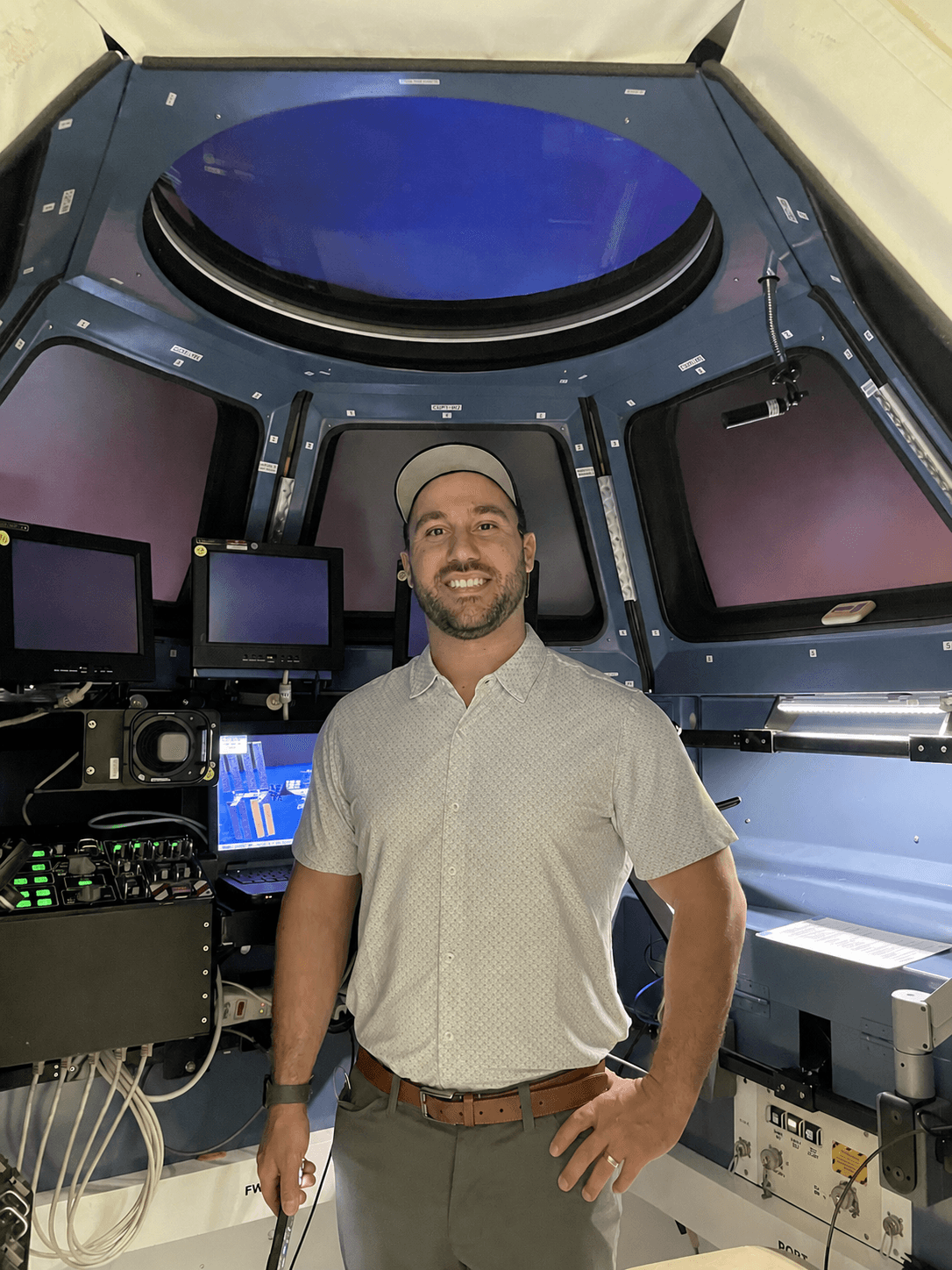 Jake Brown, founder of RedMars, standing inside a simulator training environment.